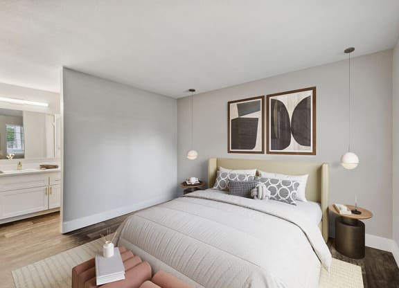 Model Bedroom with Wood-Style Flooring and attached Bathroom at Central Flats Apartments in Kent, WA.
