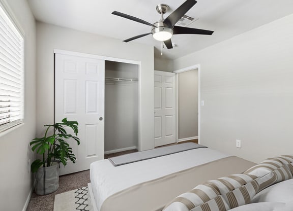 Model Bedroom with Carpet and Closet at Loma Vista Apartments in Las Vegas, NV.