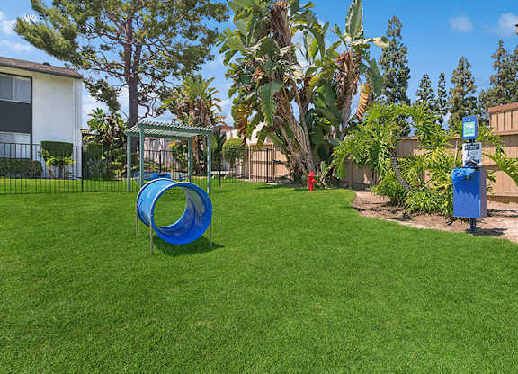 Community Dog Park with Agility Equipment at Fullerton Hills Apartments located in Fullerton, CA.