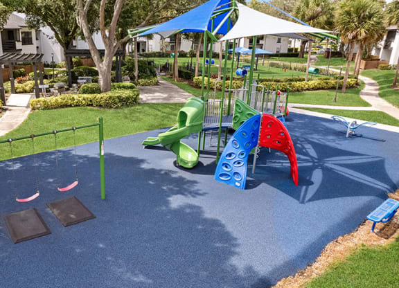 Aerial View of Community Playground and Swing Set at Rosehill Preserve Apartments in Orlando, FL.