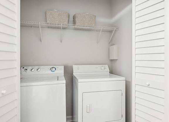 Model Laundry Room with Washer & Dryer at Dulles Green Apartments located in Herndon, VA.