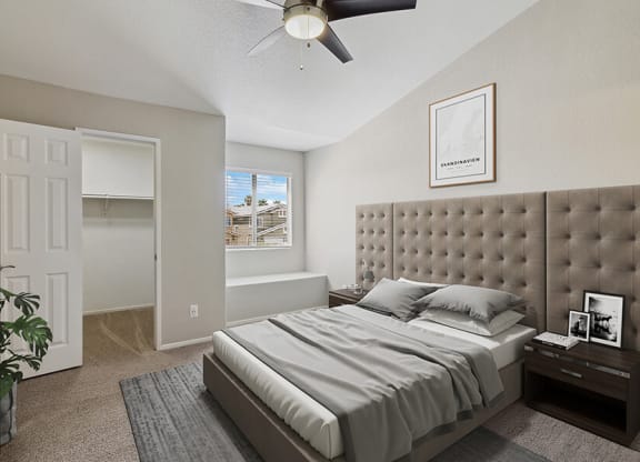 Model Bedroom with Carpet, Walk in Closet & Window Bench at Verraso Apartments in Las Vegas, NV.