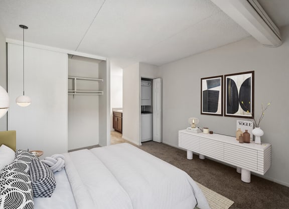 Model Bedroom with Carpet, Closet and Attached Bathroom at Mason Van Dorn Apartments located in Alexandria, VA.