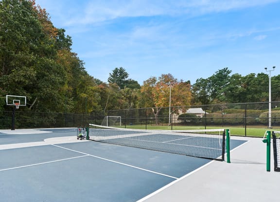Community Pickleball Courts with Nets at Meadows at Marlborough Apartments located in Marlborough, MA.