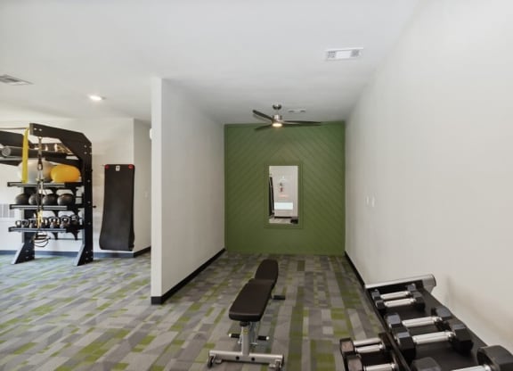 Fitness center free weights at Cobblestone, Arlington, TX
