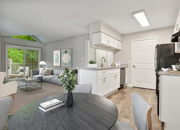Model Kitchen with Wood-Style Flooring, White Cabinets and View of Living Room at Park 2300 Apartments in Charlotte, NC.