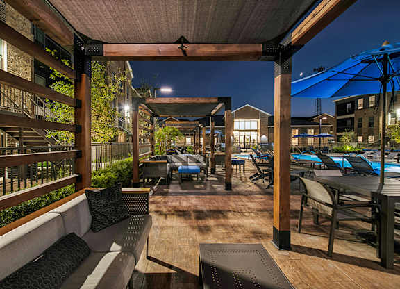 Outdoor Patio with Lounge Furniture at Alta 3Eighty Apartments located in Aubrey, TX.