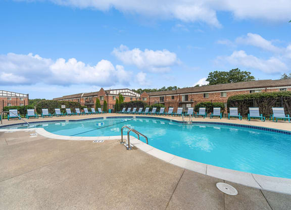 Community Swimming Pool with Pool Furniture at Heights Marlborough Apartments in Boston, MA.
