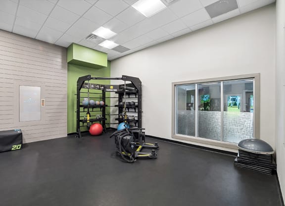 Community Fitness Center with Equipment at Rosehill Preserve Apartments in Orlando, FL.