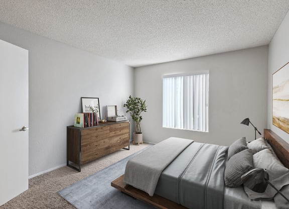 Model Bedroom with Carpet and Window View at Bridges on Sunset Apartments in Suisun City, CA.