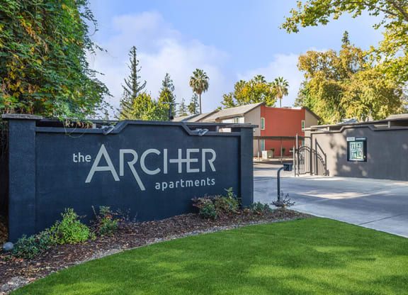 Monument Sign and Front Entrance at The Archer Apartments in Sacramento, CA.