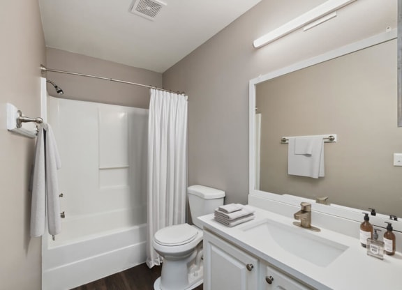 Model bathroom with white vanity at Vue at Baymeadows Apartments in Jacksonville, Florida