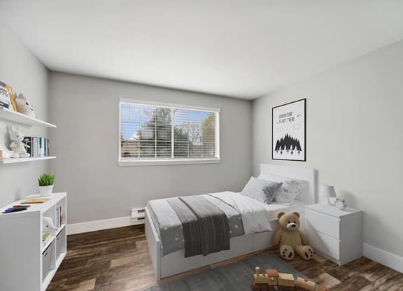 Model Bedroom with Wood-Style Flooring and Window View at Central Flats Apartments in Kent, WA.