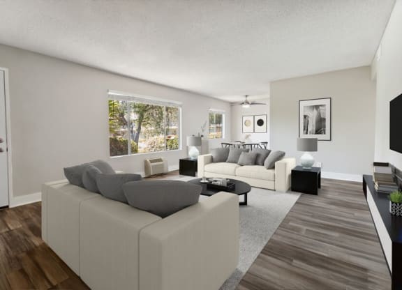 Model Living Room with Wood-Style Flooring & Window View at Forest Park Apartments in El Cajon, CA.