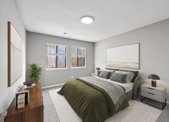 Model Bedroom with Carpet and Window View at Spring Forest Apartments in Raleigh, NC.
