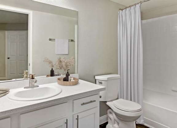 Model bathroom with a sink toilet and shower