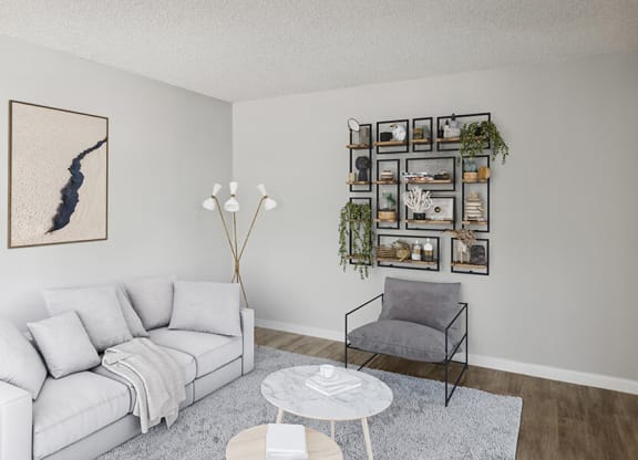 Model Living Room with Wood-Style Flooring at Hilands Apartments in Tucson, AZ.
