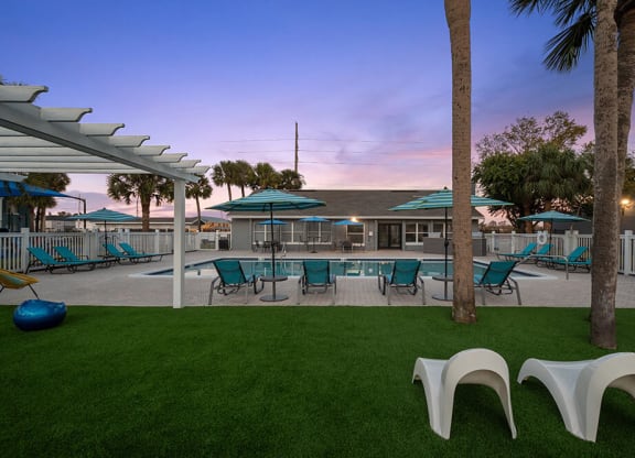 Community Swimming Pool with Pool Furniture at Park at 7200 Apartments in Jacksonville, FL.