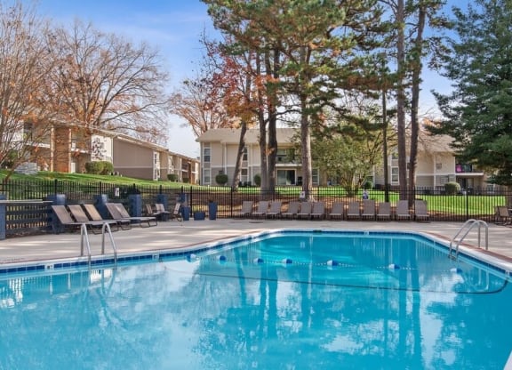 Swimming pool surrounded by lounge chairs