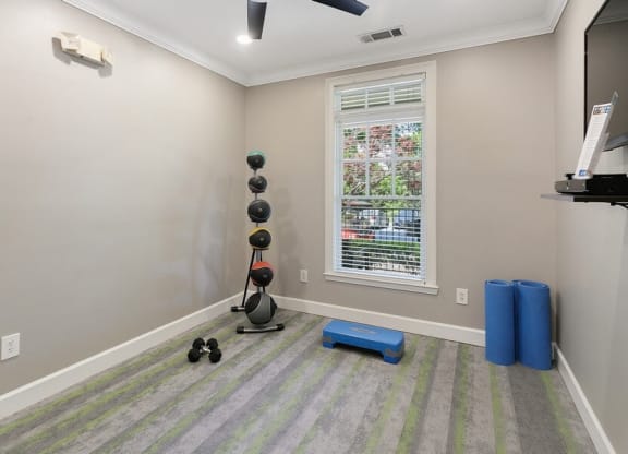 Fitness center yoga area and free weights