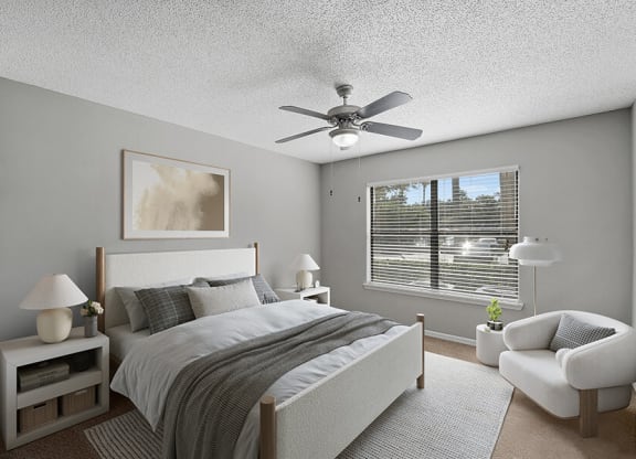Model Bedroom with Carpet and Window View at Fountains Lee Vista Apartments in Orlando, FL.
