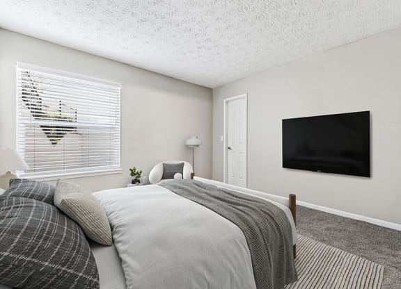 Model Bedroom with Carpet and Window View at Paramont Apartments in Duluth, GA.