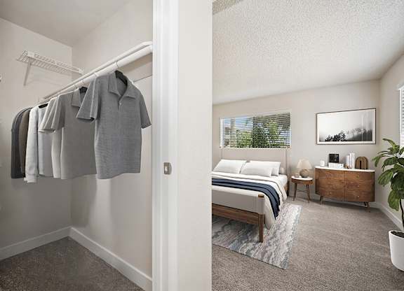 Model Bedroom with Carpet and Large Walk-In Closet at Butler Ridge Apartments located in Glendale, AZ.