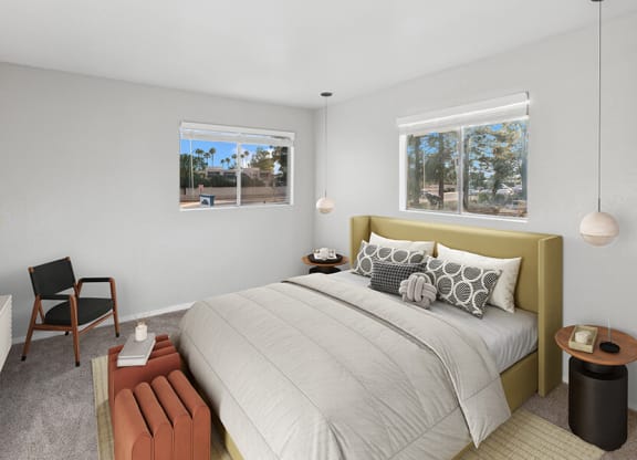 Model Bedroom with Carpet and Window View at Tanque Verde Apartments located in Tucson, AZ.