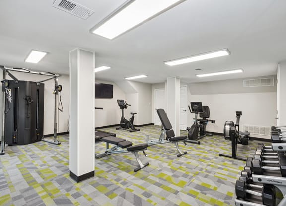 Community Fitness Center with Equipment at Parc at Creekside Apartments in Kansas City, MO.