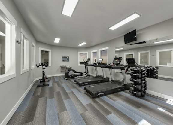 Community Fitness Center with Equipment at Landings at Morrison Apartments located in Gresham, OR.