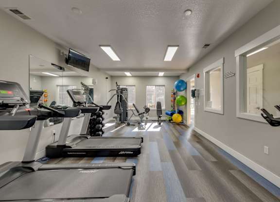 Community Fitness Center with Equipment at Landings at Morrison Apartments located in Gresham, OR.