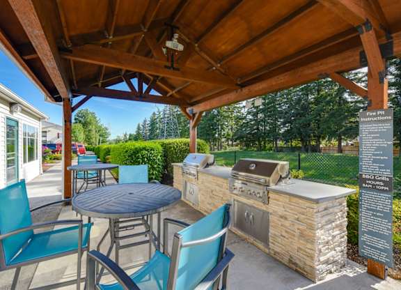 Outdoor BBQ Area with Canopy at Landings at Morrison Apartments located in Gresham, OR.