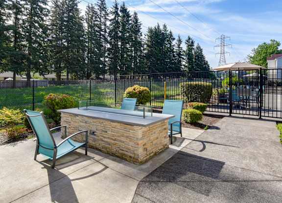 Community Fire Pit Area at Landings at Morrison Apartments located in Gresham, OR.
