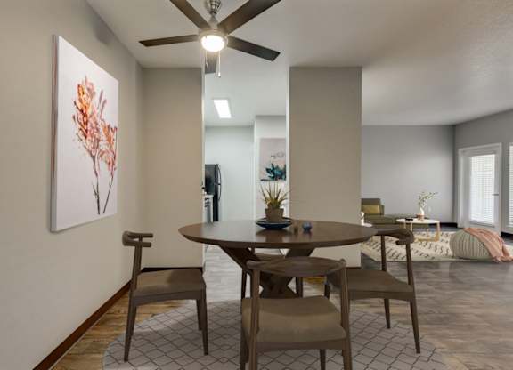 Model Dining Room with Wood-Style Flooring at Landings at Morrison Apartments located in Gresham, OR.
