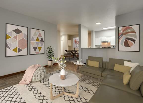 Model Living Room with Wood-Style Flooring and View of Kitchen at Landings at Morrison Apartments located in Gresham, OR.