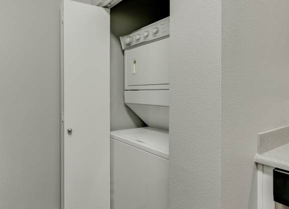 Model Laundry Room with Washer & Dryer at Landings at Morrison Apartments located in Gresham, OR.