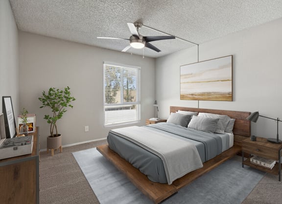 Model Bedroom with Carpet and Window View at Colonnade at Fletcher Hills Apartments in El Cajon, CA.