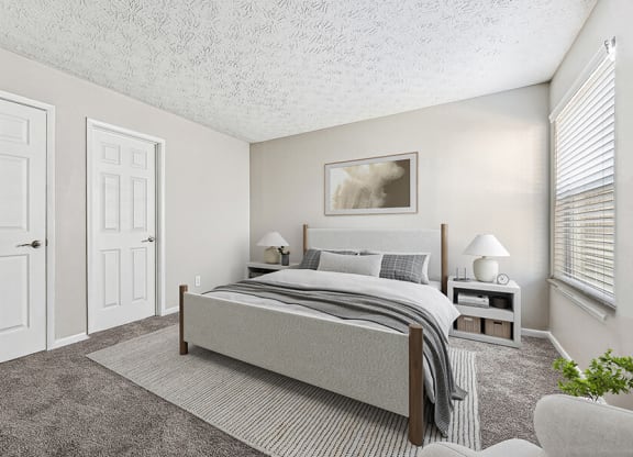Model Bedroom with Carpet and Window View at Paramont Apartments in Duluth, GA.