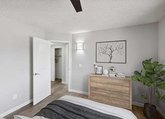 Model Bedroom with Carpet and Dresser at Hilands Apartments in Tucson, AZ.