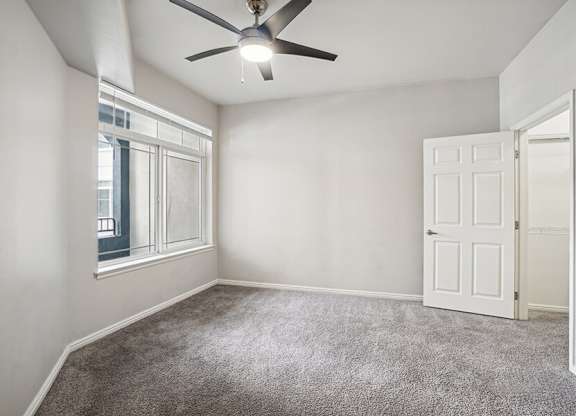 Model Bedroom with Carpet and Walk-In Closet at Altitude on Fifth Apartments located in Salt Lake City, UT.