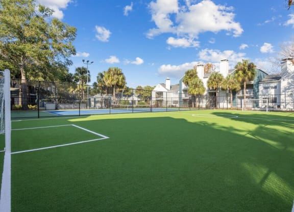 Outdoor Turf Soccer Field at Caribbean Breeze Apartments in Tampa, FL.