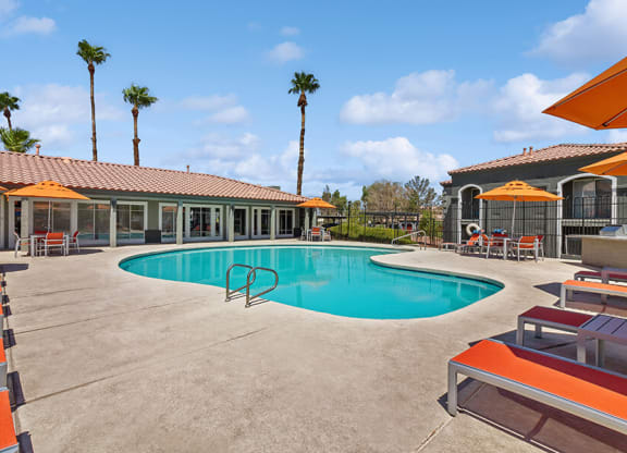 Community Swimming Pool with Pool Furniture at Loma Vista Apartments in Las Vegas, NV.