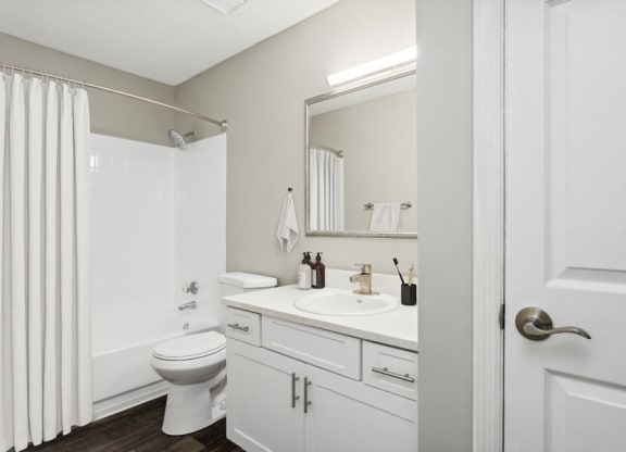 Model Bathroom Two with White Vanity at Caribbean Breeze Apartments in Tampa, FL.
