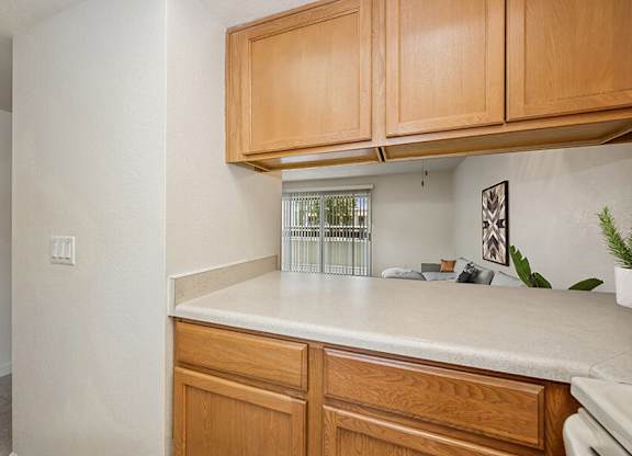 Model Classic Kitchen with Tile Flooring at Butler Ridge Apartments located in Glendale, AZ.