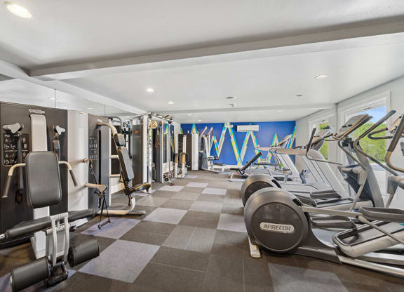 Community Fitness Center with Equipment at Central Flats Apartments in Kent, WA.