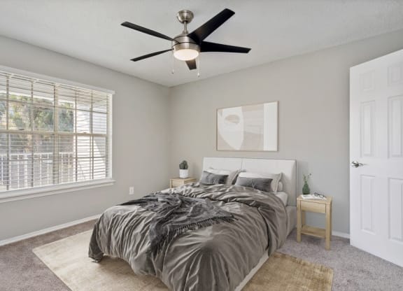 Model Bedroom One with Window View at Caribbean Breeze Apartments in Tampa, FL.