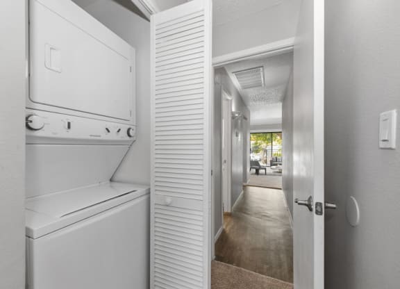 Washer and dryer and hallway in an apartment at Verona Park, Mesa, 85210