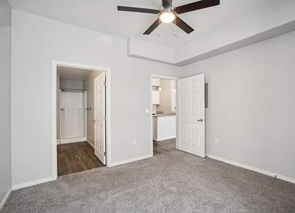 Model Bedroom with Carpet and attached Bathroom at Altitude on Fifth Apartments located in Salt Lake City, UT.