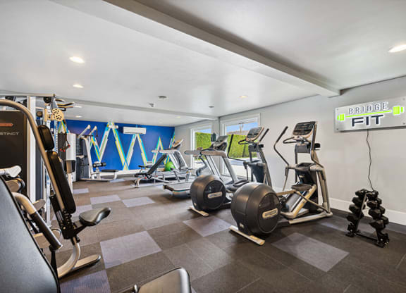Community Fitness Center with Equipment at Central Flats Apartments in Kent, WA.