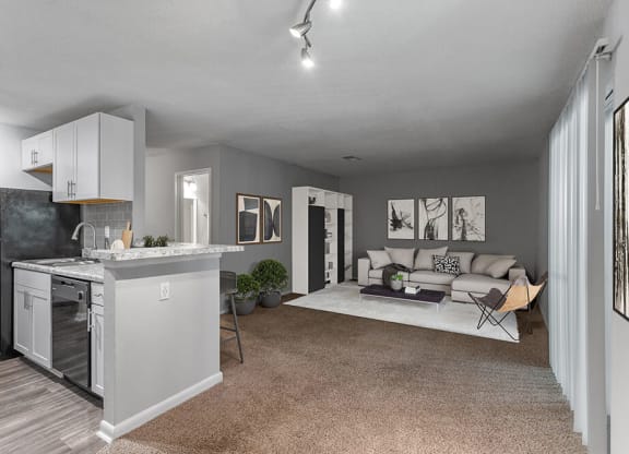 Model Living Room with Carpet and View of Kitchen at Corners at 1700 Apartments in Atlanta, GA.